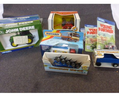 A Collection of boxed and carded diecast vehicles and accessories to include ERTL  Young Farmer x 3 and Royal Marines Land Ro