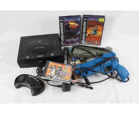 Sega Saturn console plus 3 x cased games to include Soviet Strike, Sega Rally and Darklight Conflict