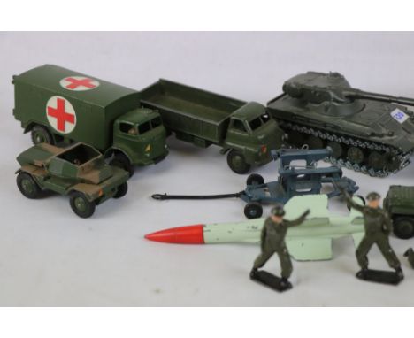10 Original Dinky and Corgi Military diecast models plus 8 Britains metal soldiers in a good play worn condition