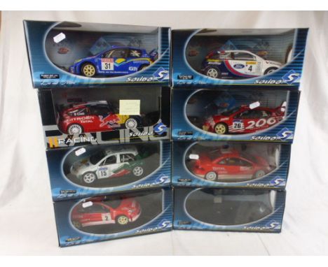 Seven boxed 1:18 Solido Racing diecast models to include 2 x Peugeot 206 (variants), Peugeot 307 WRC, Ford Focus WRC, Skoda F