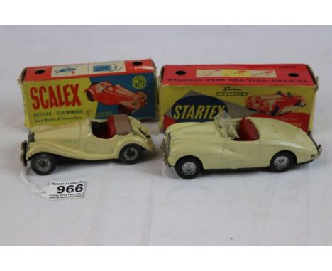 Two boxed tin plate clockwork vehicles to include Scalex MG TF in cream in fair condition, and Startex Sunbeam Alpine in crea