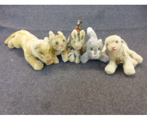 Mid 20th century vintage Steiff and other teddy bears to include Steiff recumbent lamb, cream ribbon with cow bell attached, 