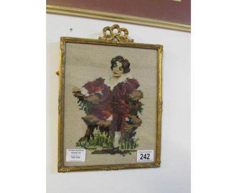 An embroidered portrait study in a gilt frame