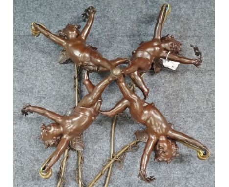 An attractive bronzed metal four branch ceiling light modelled as four cherubs holding laurel leaves and a light, width 45cm.