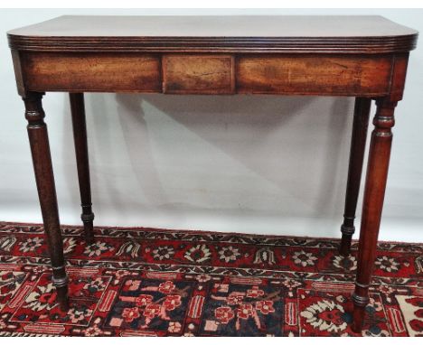 An early 19th century mahogany fold top tea table with turned legs and boxwood strung inlays, width 90cm. 