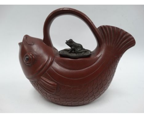 A Chinese Yixing teapot modelled as a fish, the lid as a frog on a lily pad, seal mark to the base, height 13cm. 