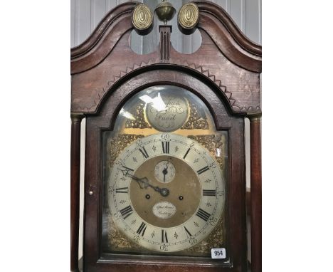 An oak cased eight day longcase clock by Alfred Minnis of Spalding with broken arch pediment, brass face with silvered chapte