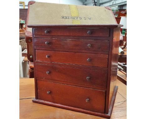 A small mahogany table top collectors chest of five graduated drawers, 33 x 34cm (AF).