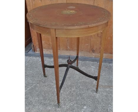 An Edwardian mahogany and painted Sheraton style occasional table, decorated with a central cartouche of musical instruments 