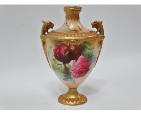 A Royal Worcester blush ivory pedestal, twin lug handle vase, No.152/H15.54, painted with roses and with twin lug lion head h