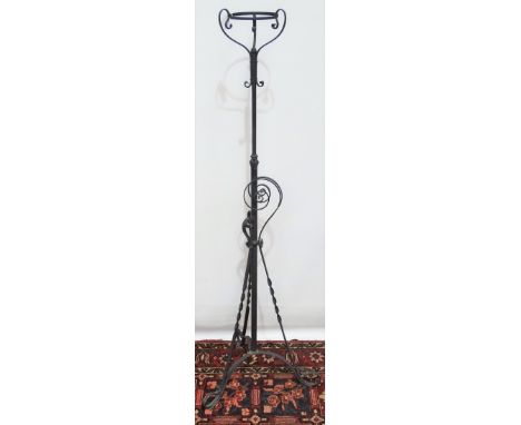 A late 19th century wrought iron oil lamp stand in Gothic taste. 