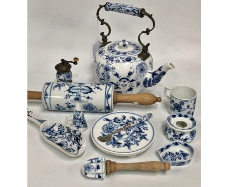 A collection of eleven Meissen 'Onion' pattern wares, including a teapot and cover (cover AF), snuffer, inkwell, rolling pin 