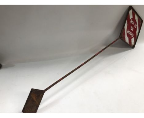 A vintage GWR Railway enamel sign 'NOT TO BE MOVED', within a metal frame and on stand, height overall 137cm.
