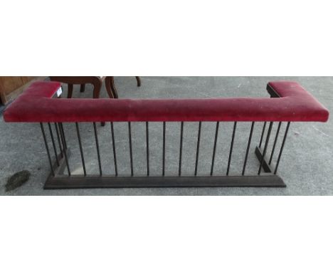 A 19th century wrought iron stuffover upholstered club fender with pink velvet upholstered seat, height 54cm, width 171cm. 