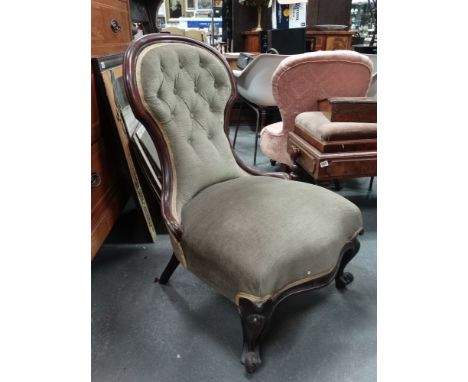 A Victorian mahogany and upholstered occasional chair with cabriole legs and button back. 