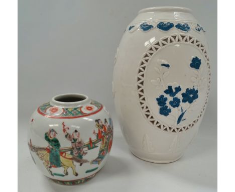 A Chinese blanc de chine ovoid pierced table lamp base, height 25cm, together with a famille verte ovoid ginger jar, height 1