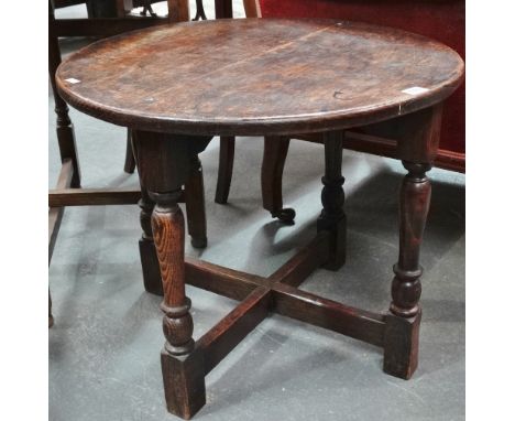 An oak framed circular occasional table. 