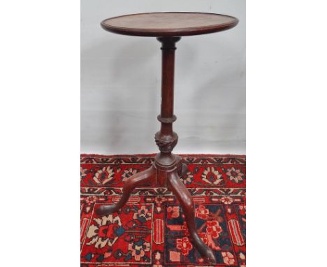 A George III mahogany wine table on tripod base and with dished top, height 64cm. 