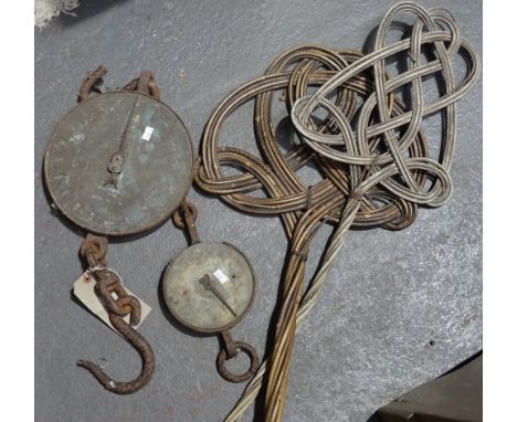 A Salter 200lb brass and iron hanging scales, another Salter balance scale and two carpet beaters. 