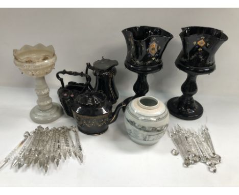 A pair of Victorian black glass table lustres with glass drops, together with two Jackfield Pottery teapots, a hot water jug 