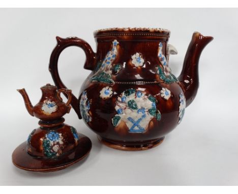 A Victorian barge ware teapot of typical decoration and with a tide tablet signed MRS F MANN WEDNESBURY, the lid with teapot 
