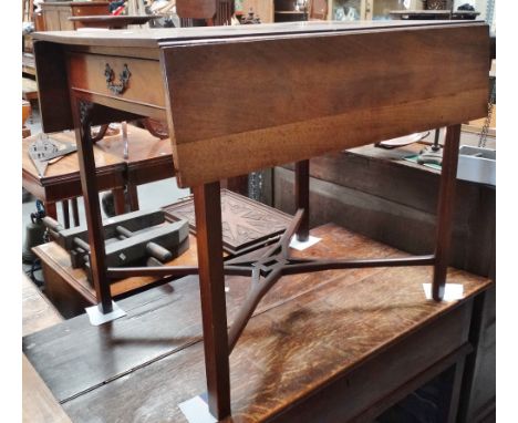 A George III mahogany Pembroke table in the Chippendale taste, fitted a single drawer and pierced leg spandrels above an X fr
