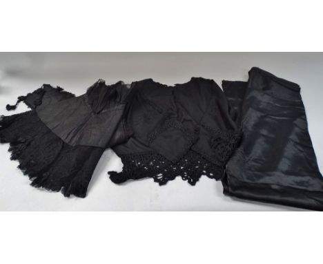 A Victorian lilac silk skirt, length 92cm, a Victorian black cotton and silk stitch cape, a ladies Victorian black silk and l