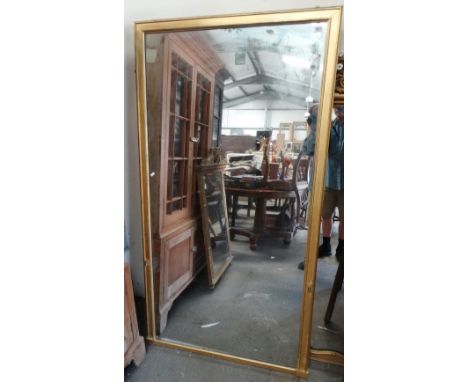 A 19th century gilt framed console mirror with plain moulded frame, marked for Frooms Looking Glass Warehouse, Strand, London
