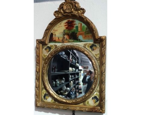 An unusual wall mirror formed from a longcase clock face, fitted a convex mirror with gilt gesso frame, width 35cm. 