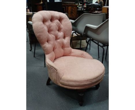 A Victorian mahogany and upholstered occasional chair with button back and pink upholstery. 