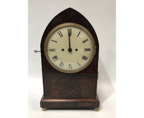 An early 19th century mahogany and ebony strung bracket clock of lancet form with twin fusee movement striking on a bell, the