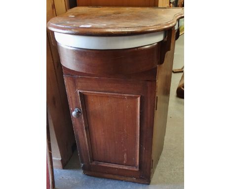 A hardwood and ceramic ship's wash basin of traditional form with cupboard below, width 54cm. 