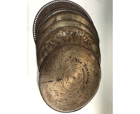 Eight 19.5 inch polyphon discs.