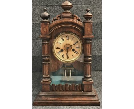 A late 19th century walnut cased mantle clock with mercury filled pendulum, height 45cm. 