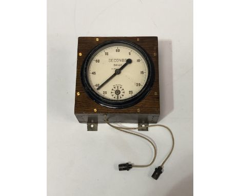 A WWII era RAF dark room clock in oak case.