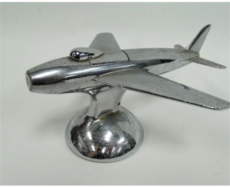 A Dunhill chromium plated table lighter in the form of an aeroplane, the nose of the plane presses to reveal the lighter mech