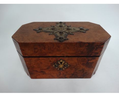 A Victorian burr walnut veneered rectangular tea caddy with canted corners, the lid with brass applied pierced strapwork and 