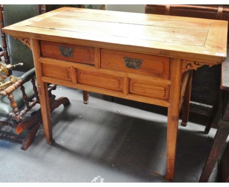 A Chinese hardwood side table of tapering form fitted with two drawers, width 117cm. 
