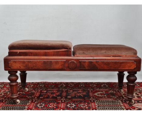 An Edwardian walnut two seat adjustable duet piano stool with turned and reeded legs stamped H.Brooks &amp; Co 87464, on bras