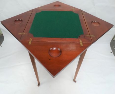 An Edwardian mahogany and inlaid envelope card table. 