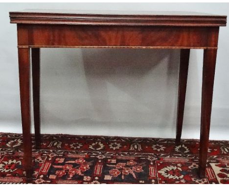 A George III mahogany tea table with moulded edges above square section tapering legs, width 86cm. 