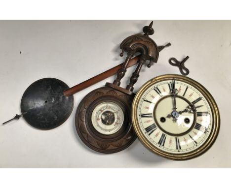 A 19th century Vienna style clock movement, together with a carved wood barometer. 