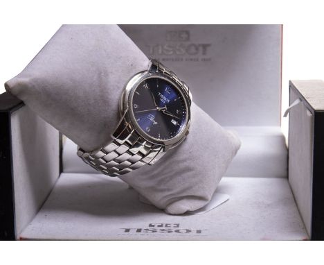 GENTLEMAN'S TISSOT RING STAINLESS STEEL QUARTZ WRIST WATCH, the round blue dial with applied stainless steel Arabic numerals,