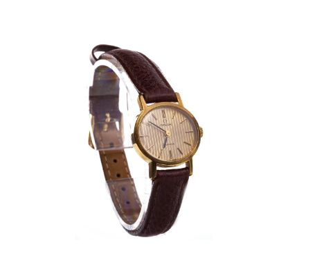 LADY'S OMEGA GOLD PLATED MANUAL WIND WRIST WATCH, signed Omega movement, the oval gold coloured dial with baton hour markers,