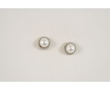 A PAIR OF DIAMOND AND CULTURED PEARL STUD EARRINGS each earring is set with a cultured pearl within a surround of circular-cu