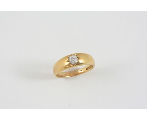 A DIAMOND SOLITAIRE RING the 18ct. gold band is set with an old brilliant-cut diamond. Size R.