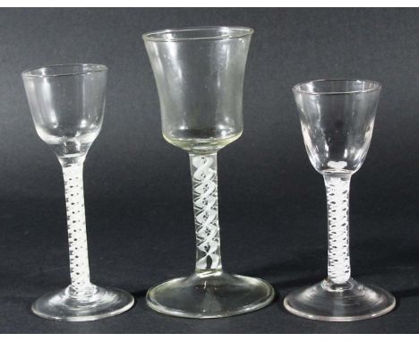 GEORGE III WINE GLASS, the ogee bowl on a stem with a multi-strand twist and double helix and spreading foot 15.5cm; another 