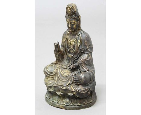 BRONZE GUANYIN, seated on a double lotus base, hands in mudra, height 34cm