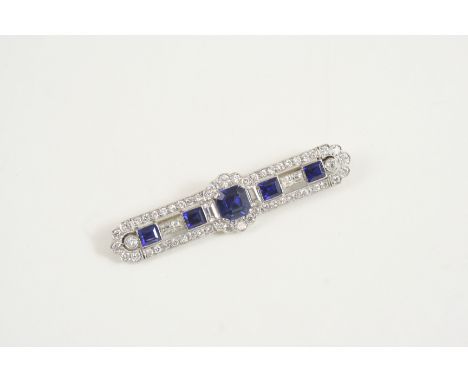 AN ART DECO SAPPHIRE AND DIAMOND PANEL BROOCH the central octagonal-shaped sapphire is set with four rectangular-shaped sapph