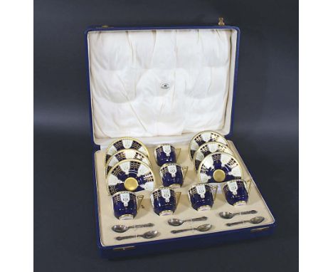 CASED ROYAL WORCESTER COFFEE SET - MAPPIN & WEBB including six coffee cups and saucers, the gilded design on a dark blue grou